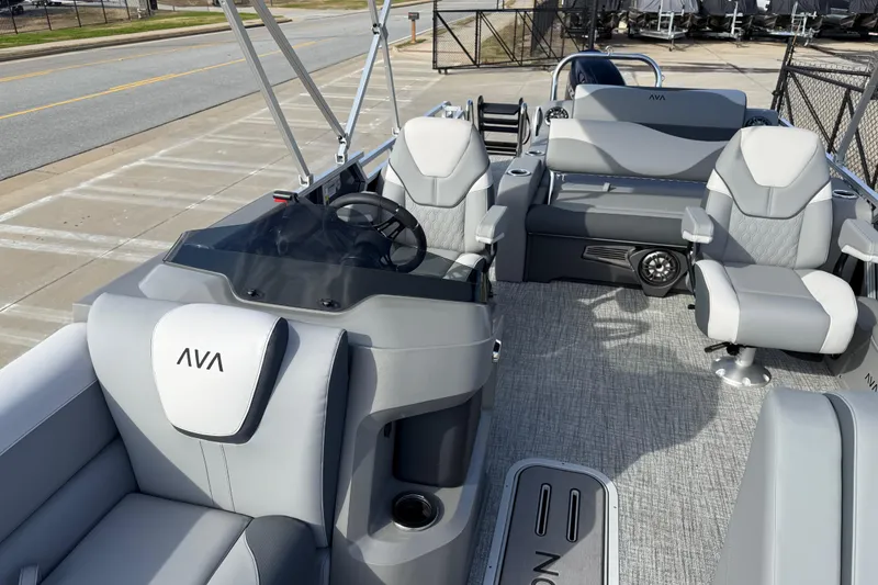 Slide: The Image of 2026 Avalon LSZ Versatile Rear Lounger boat interior with modern seating and steering console. - 16