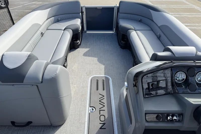 Slide: The Image of 2026 Avalon LSZ Versatile Rear Lounger boat interior with luxurious seating and modern dashboard. - 18