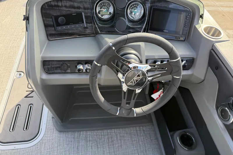 Slide: The Image of Steering console of 2026 Avalon LSZ Versatile Rear Lounger with modern controls and display. - 22