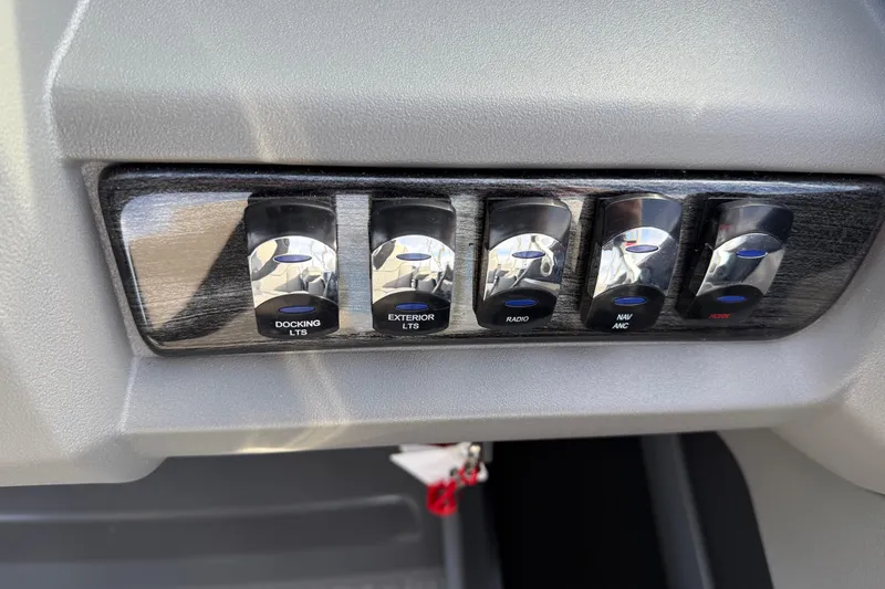 Slide: The Image of Control panel of 2026 Avalon LSZ Versatile Rear Lounger with labeled switches. - 26