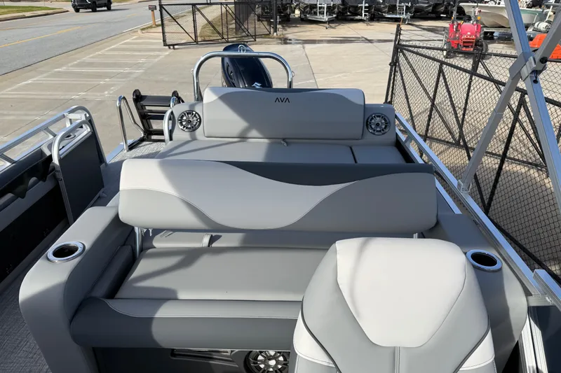 Slide: The Image of 2026 Avalon LSZ Versatile Rear Lounger boat with sleek gray seating and cup holders. - 29