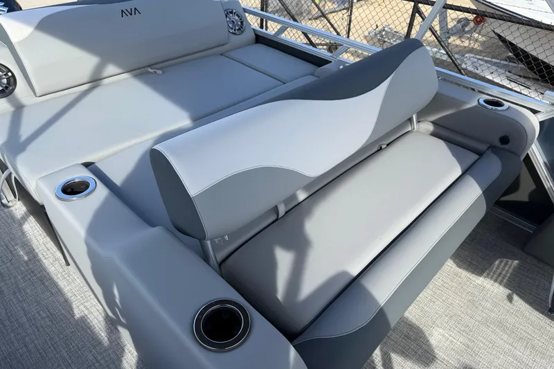 Slide: The Image of 2026 Avalon LSZ Versatile Rear Lounger with gray seating and cup holders on a boat deck. - 31