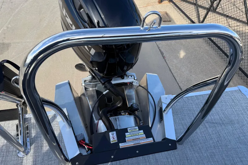 Slide: The Image of 2026 Avalon LSZ Versatile Rear Lounger boat engine and railing detail. - 34