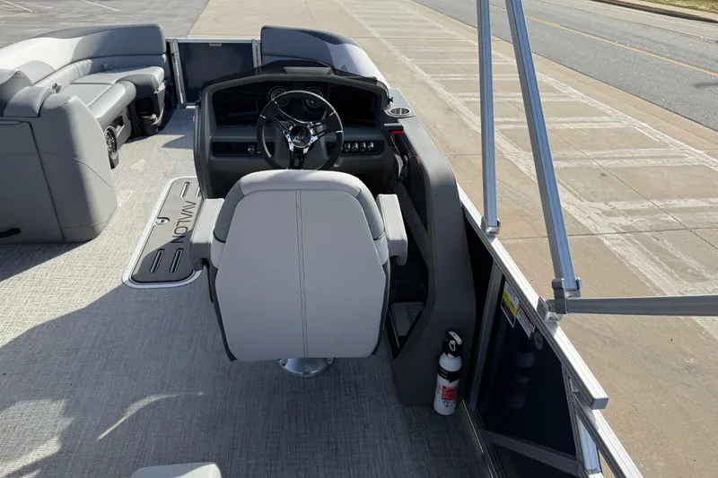 Slide: The Image of 2026 Avalon LSZ Versatile Rear Lounger boat interior with steering console and seating. - 39
