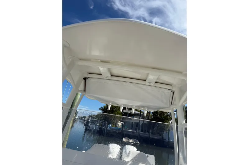 Slide: The Image of 2017 Stamas 308 Predator boat interior with clear sky and waterfront view. - 17