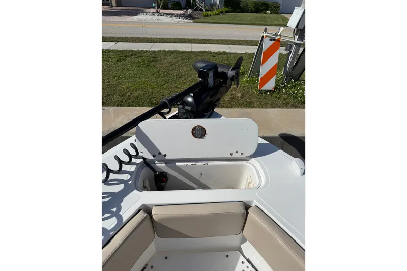 Slide: The Image of 2017 Stamas 308 Predator boat interior with storage compartment and trolling motor. - 22