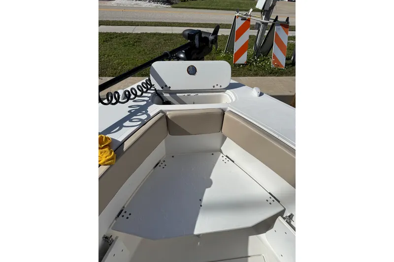 Slide: The Image of 2017 Stamas 308 Predator boat interior with seating and storage compartments. - 23