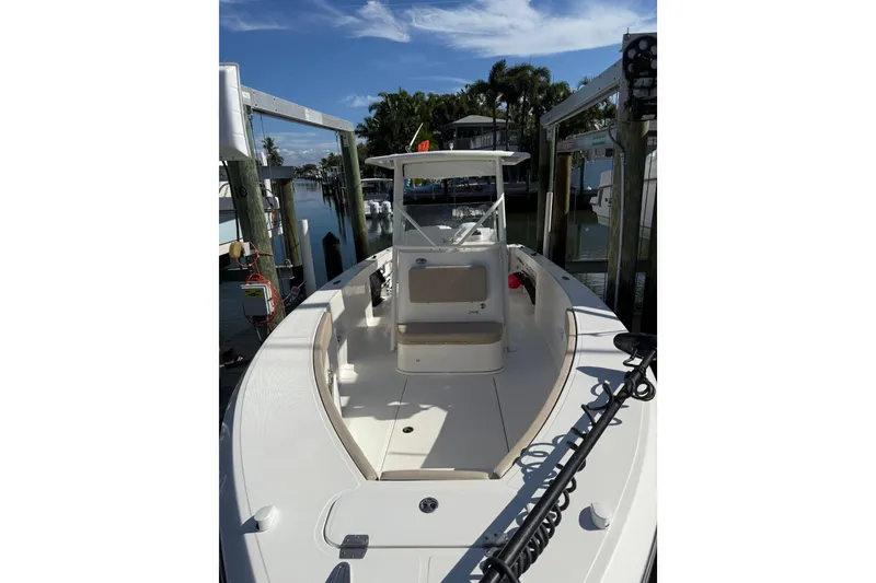 Slide: The Image of 2017 Stamas 308 Predator boat docked, showcasing spacious deck and sleek design. - 28