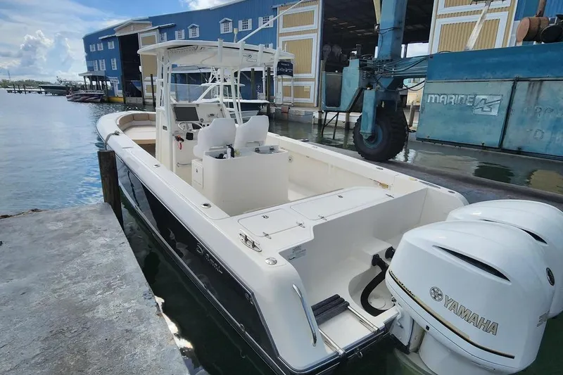 Slide: The Image of 2017 Stamas 308 Predator boat docked with Yamaha engines, marina background. - 6
