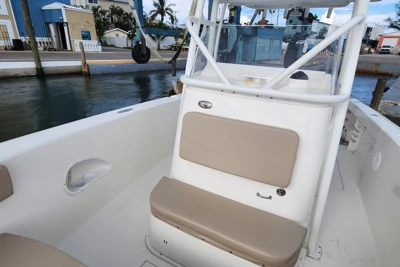 Slide: The Image of 2017 Stamas 308 Predator boat interior with beige seating, dockside view. - 7