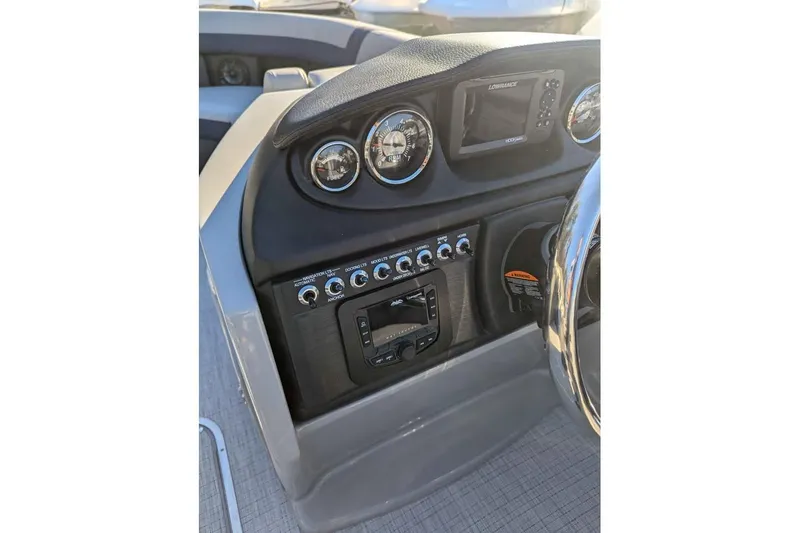 Slide: The Image of Control panel of 2025 Berkshire 22CL CTS 3.0 boat with gauges and navigation system. - 12