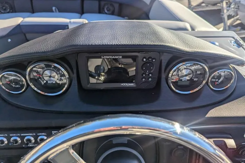 Slide: The Image of Dashboard of 2025 Berkshire 22CL CTS 3.0 with gauges and Lowrance display. - 13