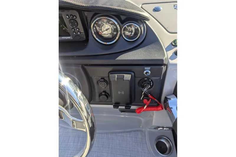 Slide: The Image of Dashboard of 2025 Berkshire 22CL CTS 3.0 boat with steering wheel and controls. - 14