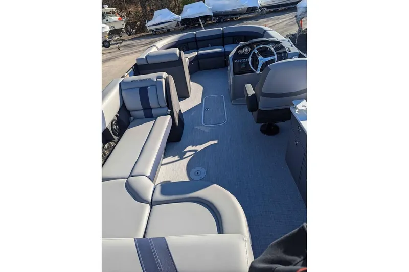 Slide: The Image of 2025 Berkshire 22CL CTS 3.0 pontoon boat interior with plush seating and modern dashboard. - 7