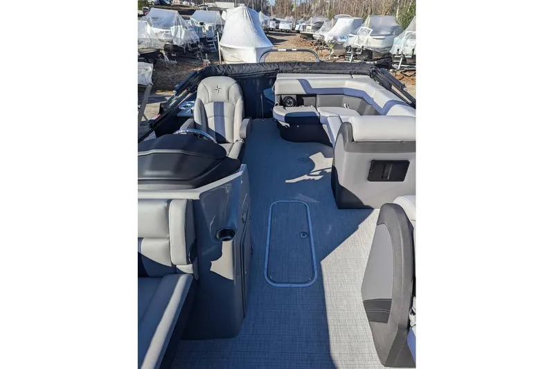 Slide: The Image of 2025 Berkshire 22CL CTS 3.0 pontoon boat interior with gray seating and helm. - 8