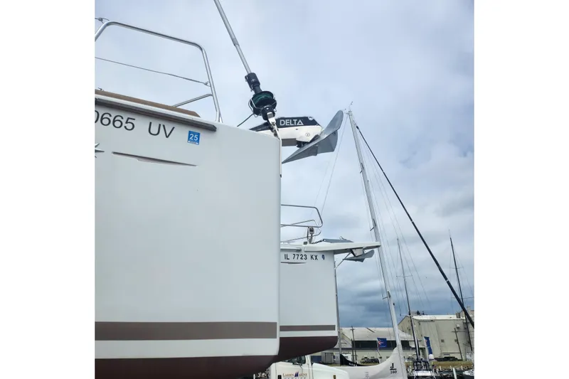 Slide: The Image of 2023 Jeanneau Sun Odyssey 349 sailboats docked under cloudy skies. - 11