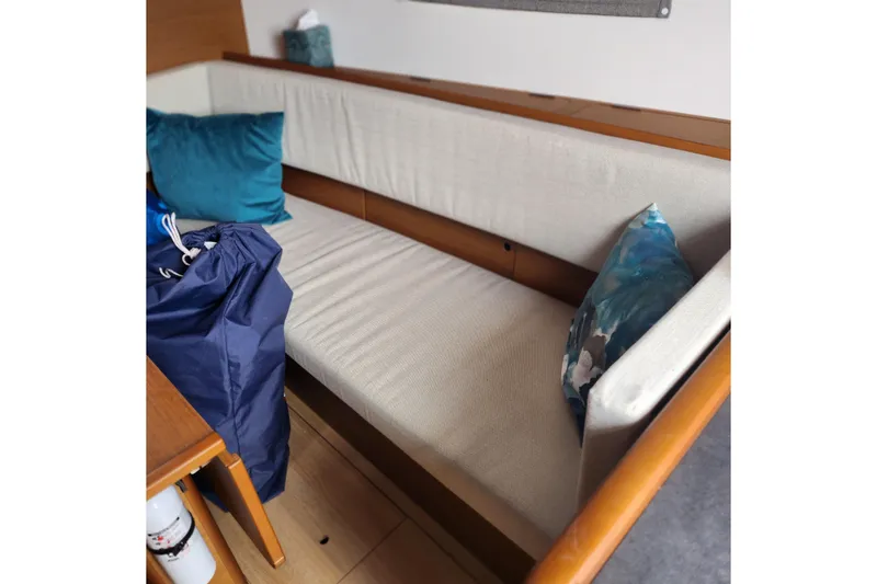 Slide: The Image of Interior of 2023 Jeanneau Sun Odyssey 349 with cozy seating and cushions. - 15