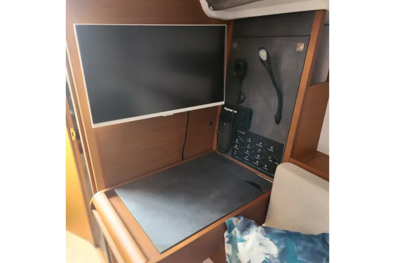 Slide: The Image of Interior of 2023 Jeanneau Sun Odyssey 349 yacht with navigation equipment and screen. - 16