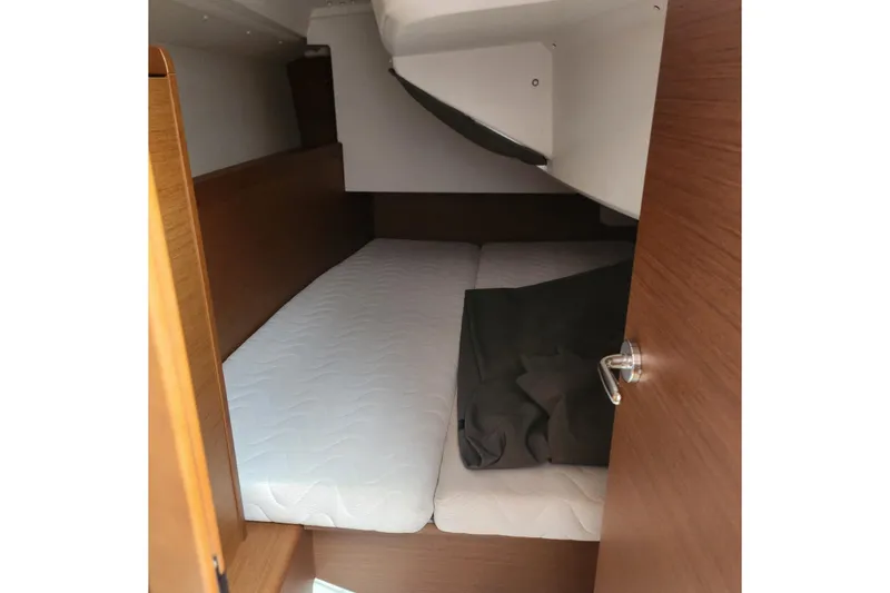 Slide: The Image of Cozy cabin interior of 2023 Jeanneau Sun Odyssey 349 sailboat with wooden finish. - 17