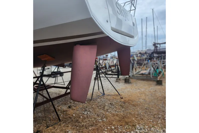 Slide: The Image of 2023 Jeanneau Sun Odyssey 349 sailboat on stands in a boatyard. - 22
