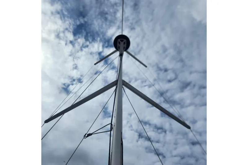 Slide: The Image of Mast of 2023 Jeanneau Sun Odyssey 349 sailboat against cloudy sky. - 3