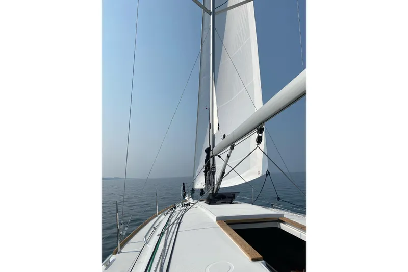 Slide: The Image of 2023 Jeanneau Sun Odyssey 349 sailing on calm waters under clear skies. - 5