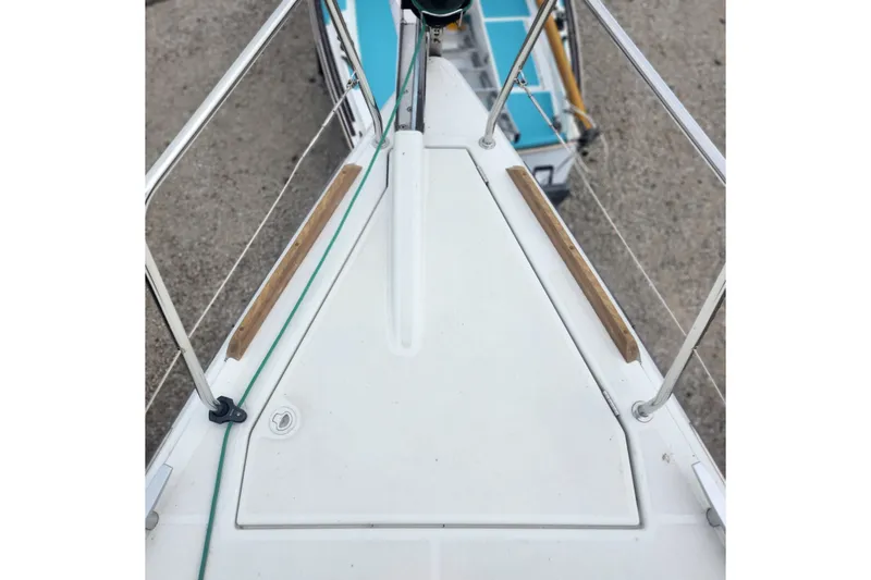 Slide: The Image of Bow view of 2023 Jeanneau Sun Odyssey 349 sailboat, featuring deck details and railing. - 8