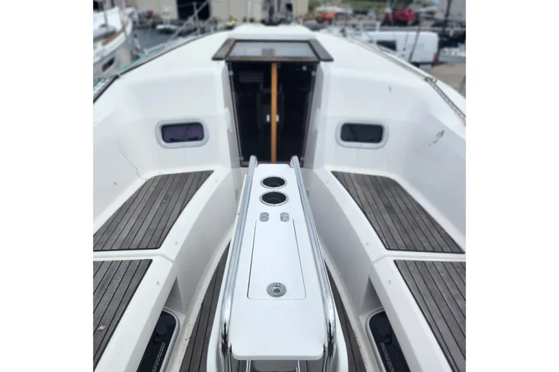 Slide: The Image of 2023 Jeanneau Sun Odyssey 349 cockpit with sleek design and wooden seating. - 9