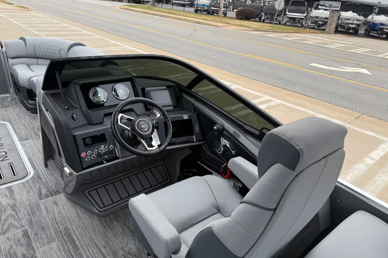 Slide: The Image of 2026 Avalon Catalina Quad Lounger Windshield boat interior with modern dashboard and comfortable seating. - 14