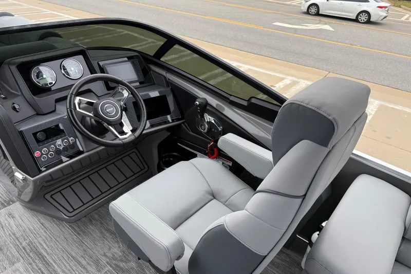 Slide: The Image of 2026 Avalon Catalina Quad Lounger Windshield boat interior with modern dashboard and comfortable seating. - 17