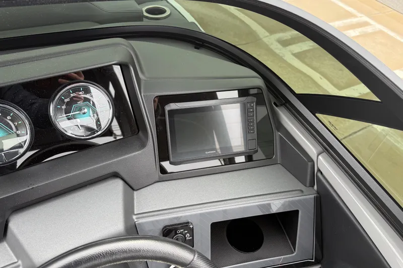 Slide: The Image of 2026 Avalon Catalina Quad Lounger Windshield dashboard with gauges and Garmin display. - 20