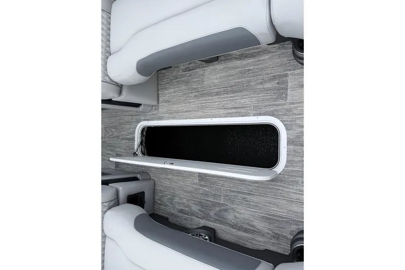 Slide: The Image of 2026 Avalon Catalina Quad Lounger Windshield interior with open storage compartment. - 28