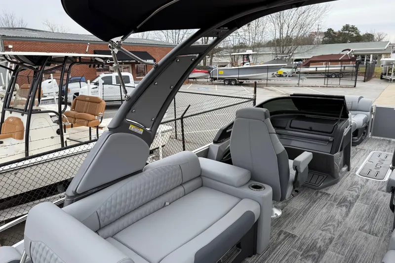 Slide: The Image of 2026 Avalon Catalina Quad Lounger Windshield boat interior with gray seating and modern design. - 36