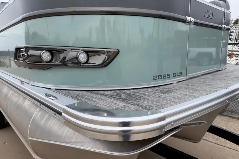 Slide: The Image of 2026 Avalon Catalina Quad Lounger Windshield boat, sleek design, modern features, docked. - 39