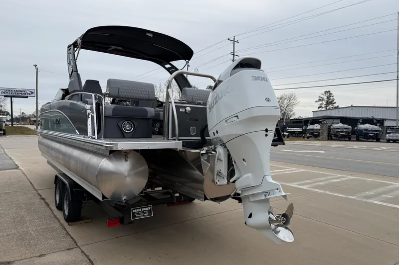 Slide: The Image of 2026 Avalon Catalina Quad Lounger Windshield boat with Suzuki 300 engine on trailer. - 4