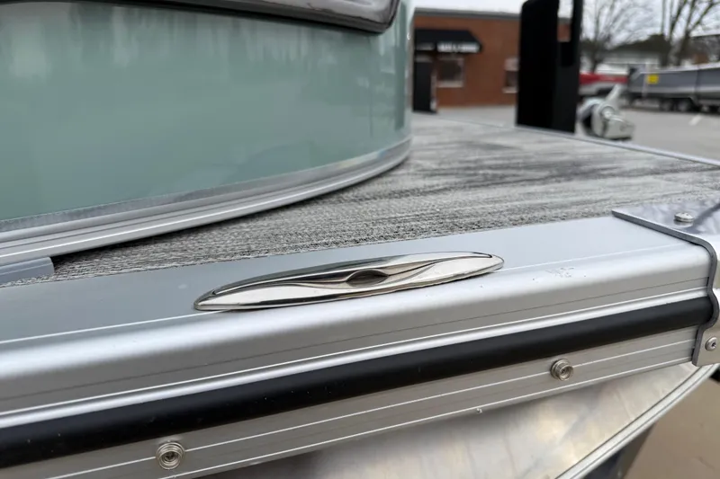 Slide: The Image of 2026 Avalon Catalina Quad Lounger Windshield, close-up of sleek deck cleat design. - 40