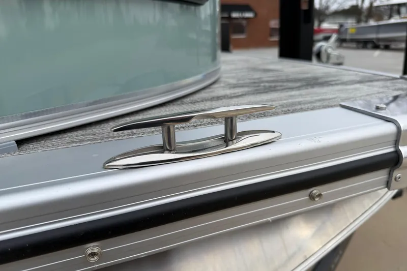 Slide: The Image of 2026 Avalon Catalina Quad Lounger Windshield boat cleat detail. - 41