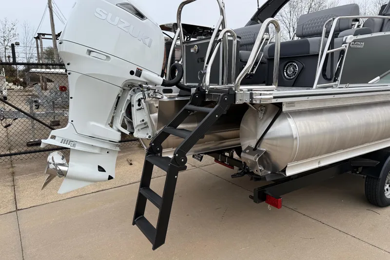 Slide: The Image of 2026 Avalon Catalina Quad Lounger Windshield with Suzuki outboard motor and boarding ladder. - 42