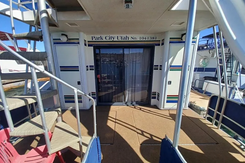 Slide: The Image of 1996 Stardust Cruisers 1655 houseboat deck with stairs, Park City Utah signage. - 33