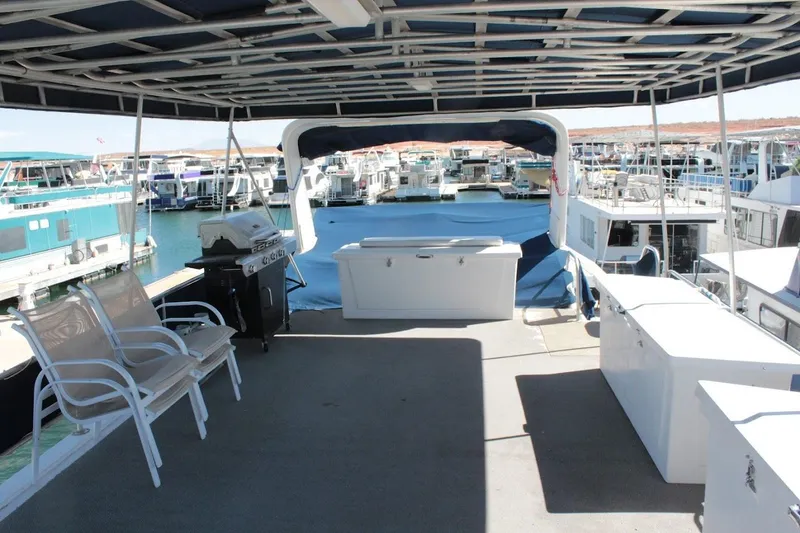 Slide: The Image of Spacious deck of 1996 Stardust Cruisers 1655 houseboat with seating and grill. - 41