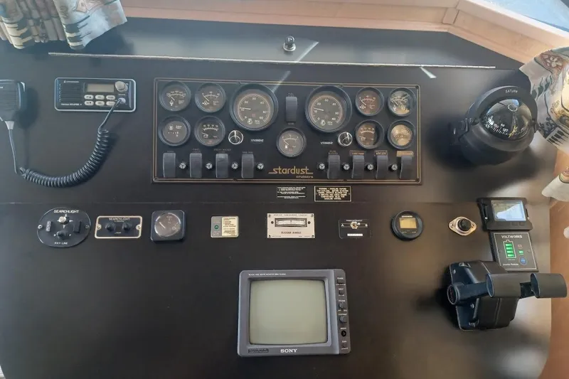 Slide: The Image of Control panel of a 1996 Stardust Cruisers 1655 boat with gauges and navigation equipment. - 7