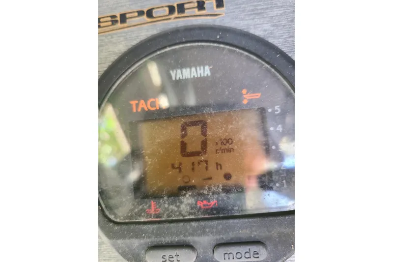 Slide: The Image of Yamaha tachometer display on 2003 Aquasport 205 Osprey boat, showing 417 hours. - 12