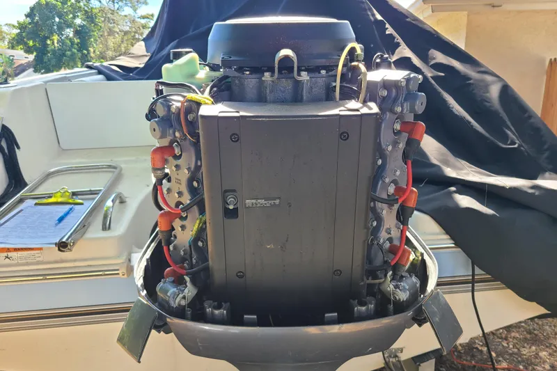 Slide: The Image of 2003 Aquasport 205 Osprey boat engine, detailed view with wiring and components. - 19