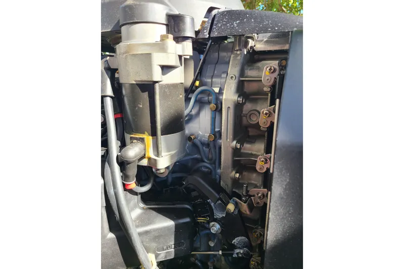 Slide: The Image of Close-up of a 2003 Aquasport 205 Osprey boat engine components. - 21