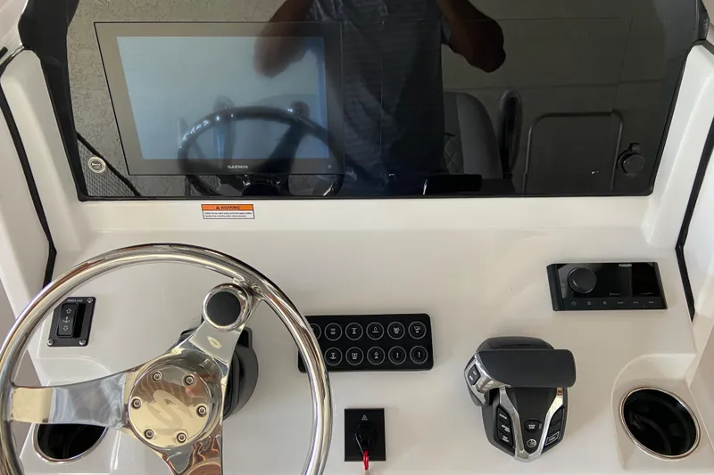 Slide: The Image of 2026 Sportsman Open 232 Center Console dashboard with steering wheel, touchscreen, and controls. - 13