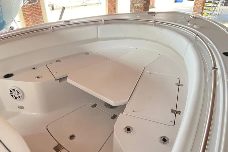 Slide: The Image of 2026 Sportsman Open 232 Center Console boat interior with seating and storage compartments. - 21