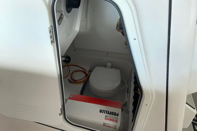 Slide: The Image of Interior view of 2026 Sportsman Open 232 Center Console boat compartment. - 32