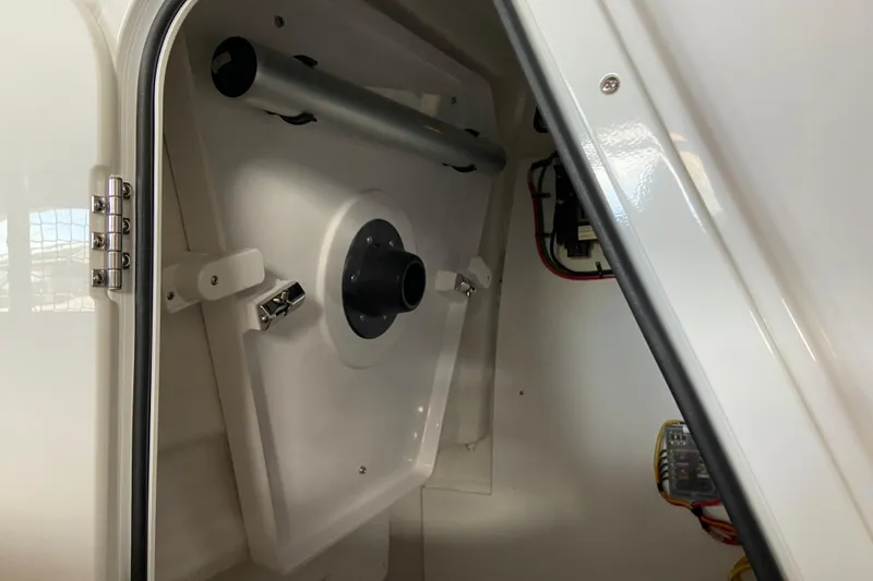 Slide: The Image of 2026 Sportsman Open 232 Center Console interior compartment with wiring and storage features. - 33