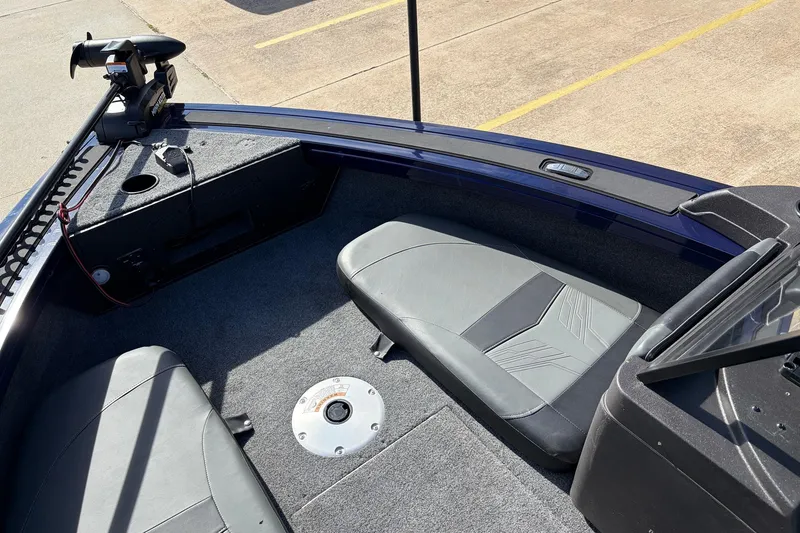 Slide: The Image of 2024 Tracker Targa V-18 Combo boat interior with seating and trolling motor. - 14