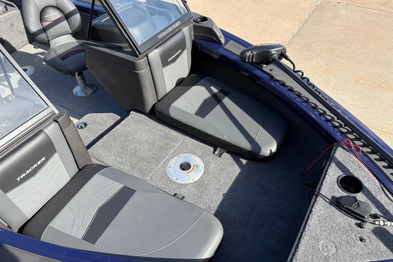 Slide: The Image of 2024 Tracker Targa V-18 Combo boat interior with seating and control panel. - 15